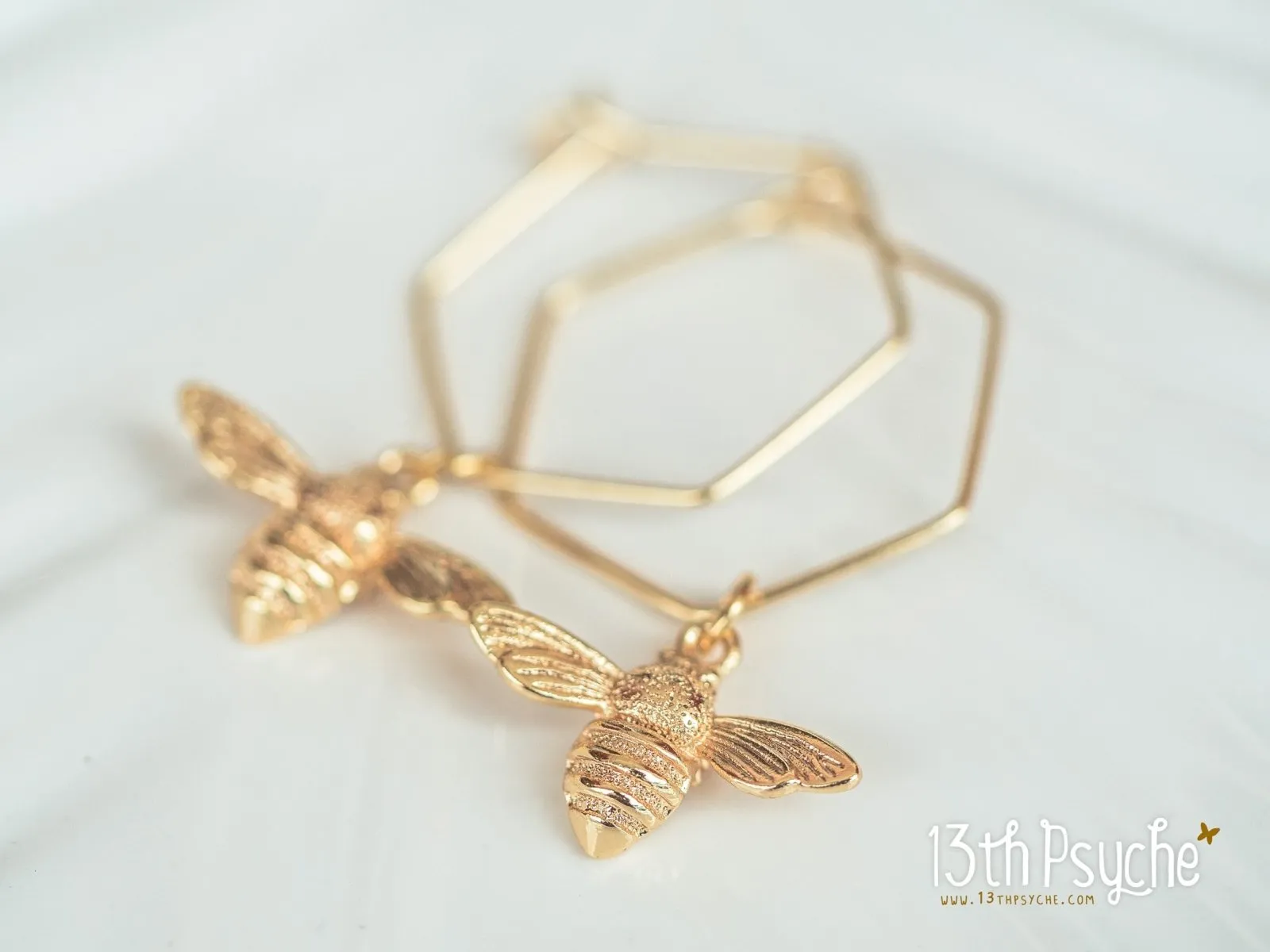 Hexagon hoop earrings with bee charms